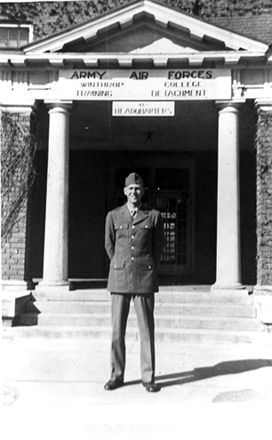 an aviation cadet standing in front of Bancroft Hall
