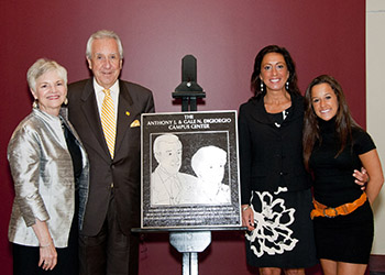 the DiGiorgio family beside the plaque dedicating the DiGiorgio Campus Center