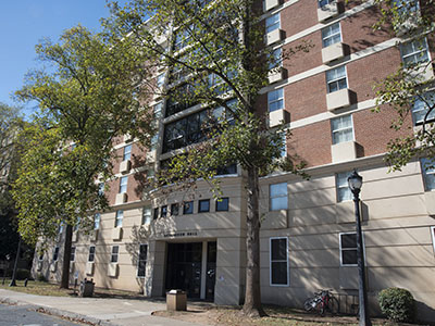 Full view of eight-floor residence hall with an off-white exterior and many windows.
                     Richardson Hall