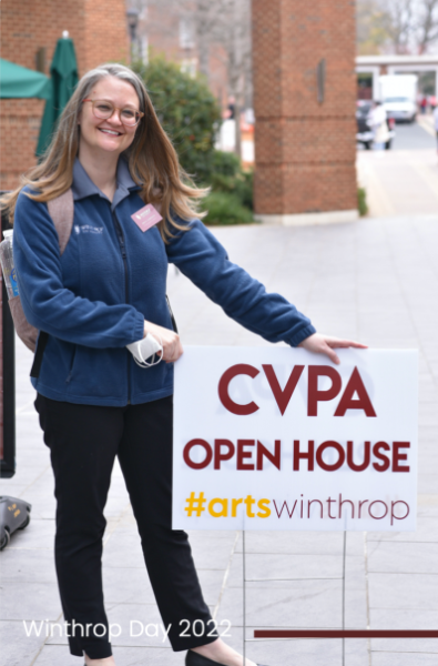 woman holding cvpa open house sign
