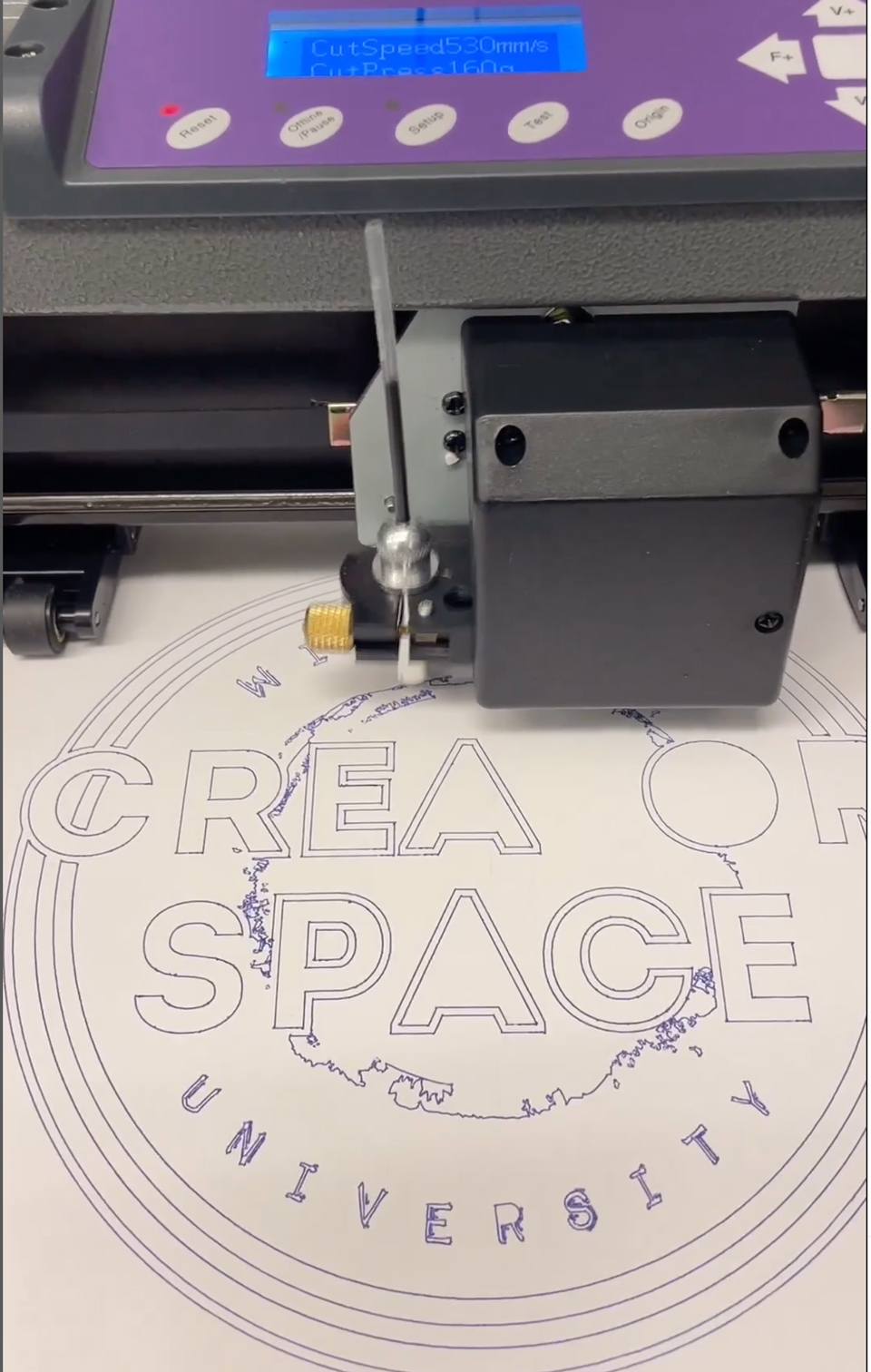 the creator space logo being cut out of vinyl