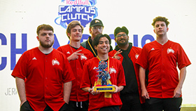 Winthrop Valorant Team holding a trophy in front of the Campus Clutch logo