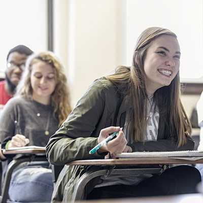 students smiling in class
