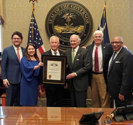 Gary Simrill of the President's Office, from left, Kim Lee, Richard Lee, Governor Henry McMaster, and Board of Trustee members Gary Williams and Glenn McCall