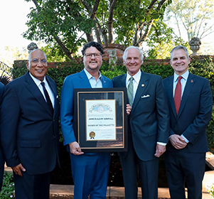 Gary Simrill receives the Order of the Palmetto. Pictured here with Board of Trustees
                     Chair Glenn McCall, SC Governor Henry McMaster, and Winthrop President Edward Serna