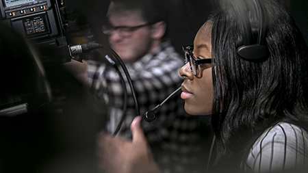 A student using a video camera